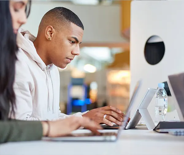Students using laptop and tablet