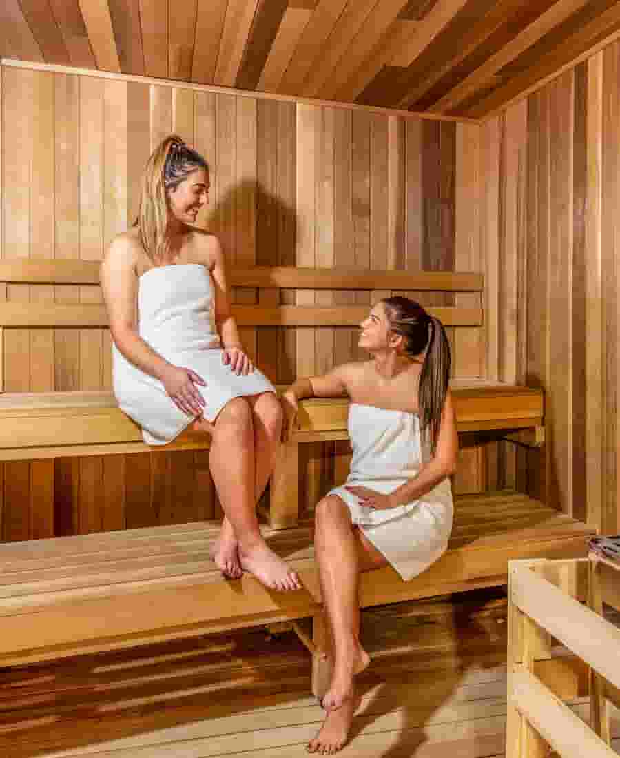 Students relaxing in the traditional sauna with real wood