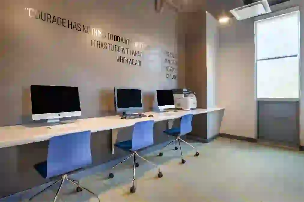 Print station at Rise with Macs and PCs available
