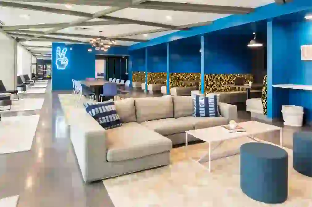Wide image showing the Club Lounge with conference, both seating, and lounge seating